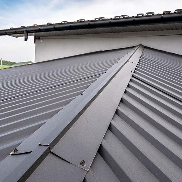 Gutter system for a metal roof. Holder gutter drainage system on the roof